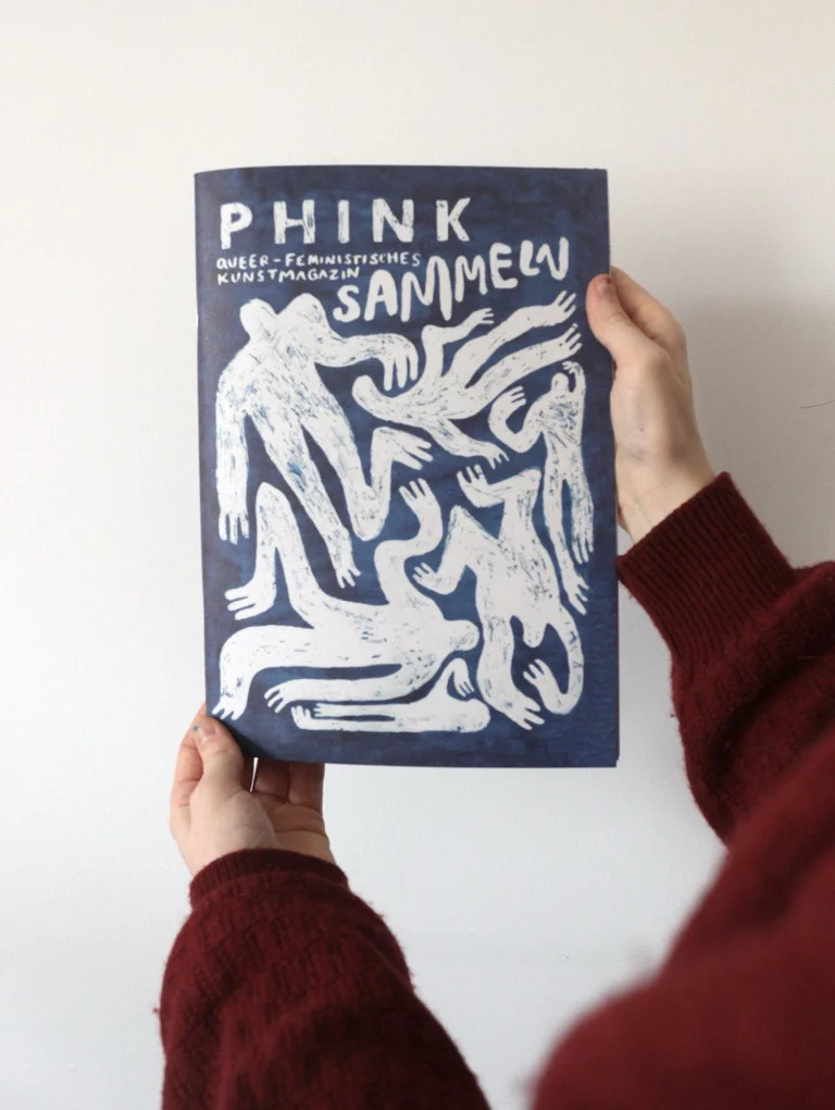 Two hands holding a magazine with PHINK and COLLECT written on it