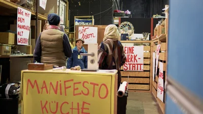 Posters display the words ‘Manifesto Kitchen’ and the question: How can we grow old with craftsmanship?