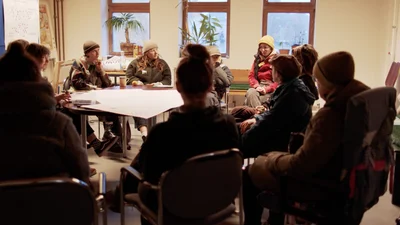 Several women are sitting in a circle