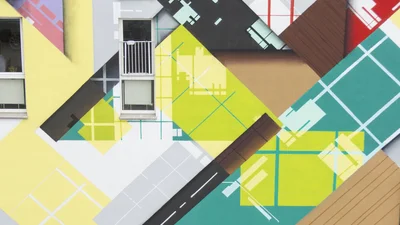 a large geometric graffiti mural on a building