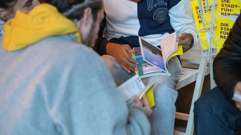 People reading the magazine.
